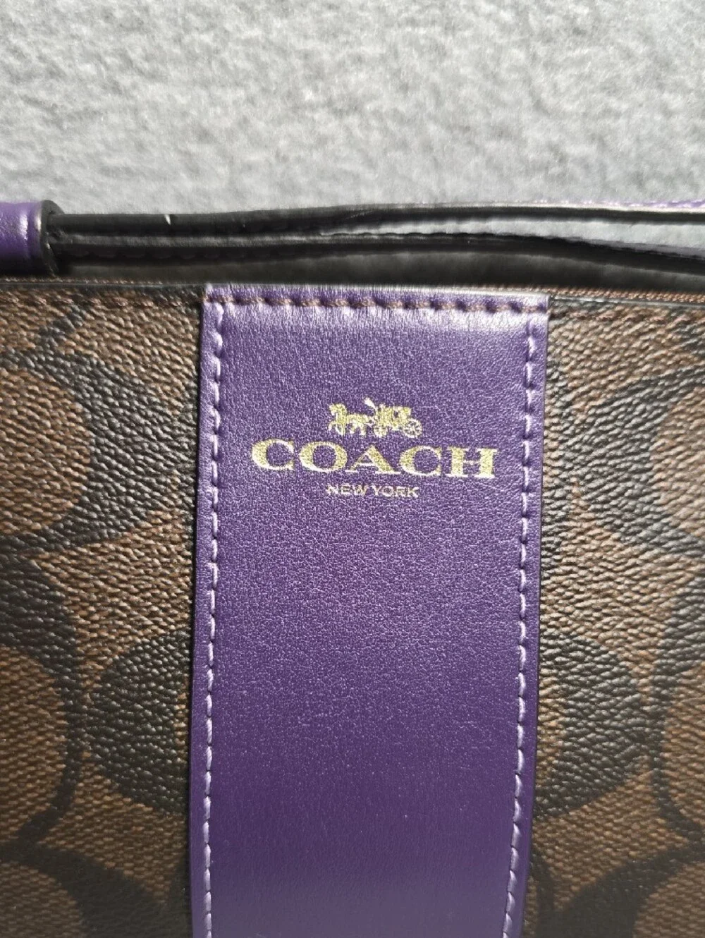 Coach Brown Signature Coated Canvas Wristlet with Purple Leather Center Stripe